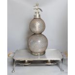 An Asprey two handled hot plate and a double gourd shaped soda stream, 50 cms high.