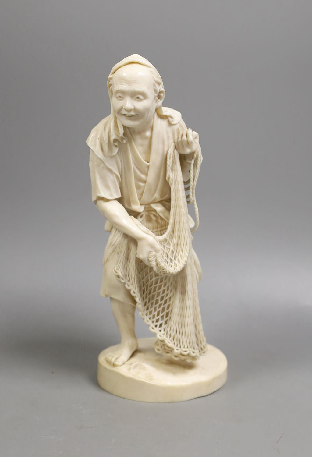 A large Japanese Tokyo School ivory figure of a fisherman, signed, Meiji period,26 cms high. - Image 2 of 5