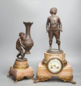 A spelter and marble figural mantel clock and a matching vase 47cm