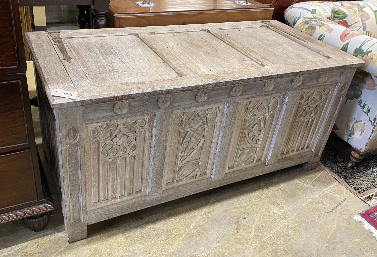 A 17th century style bleached oak coffer, length 136cm, depth 61cm, height 63cm