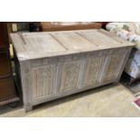 A 17th century style bleached oak coffer, length 136cm, depth 61cm, height 63cm