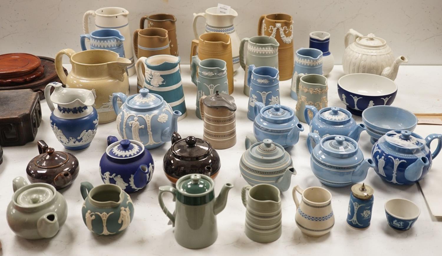 A collection of Dudson stoneware, including jugs, teapots, cream jugs etc, many decorated in low