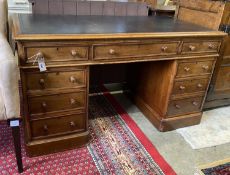 A Victorian mahogany pedestal desk, fitted with nine small drawers, length 138cm, depth 68cm, height