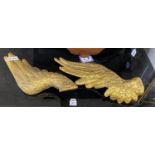 A pair of gilt composition angel wing wall appliques, width 50cm, length 58cm