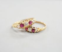 Two early 20th century 18ct gold, ruby and diamond five stone set half hoop rings, sizes m and P/