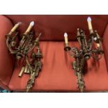 A pair of late 19th / early 20th century gilt metal six branch wall lights (converted to