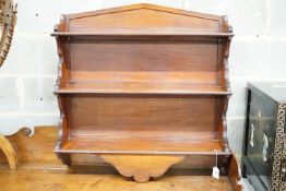 A late Victorian mahogany three tier wall shelf, width 86cm, height 86cm