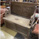 A late 19th century Flemish carved oak settle, length 130cm, depth 58cm, height 118cm