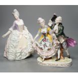 An Italian porcelain group of a dancing couple, 31cm, and an Italian maiolica figure of a lady