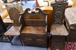 An early 20th century carved oak hall seat, width 64cm, depth 28cm, height 88cm together with two