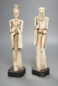 A pair of Chinese carved bone figuresTallest 27 cms high.