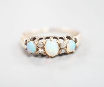 An early 20th century yellow metal three stone white opal and four stone diamond chip set half