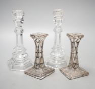 A pair of Tiffany & Co. glass candlesticks and a pair of silver overlaid glass candlesticks 20cm