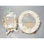 Two German porcelain easel mirrors and a Belleek easel mirror, tallest 43cm