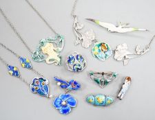 A small collection of early to mid 20th century silver or white metal and enamel jewellery,