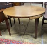 A mid century design Frem Rojle Roundette extending circular teak dining table extending circular