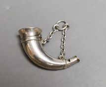 A late Victorian white metal novelty combination vinaigrette/whistle, modelled as a hunting horn, by