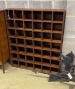 A mahogany pigeonhole wall unit, width 104cm, depth 21cm, height 122cm