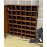 A mahogany pigeonhole wall unit, width 104cm, depth 21cm, height 122cm