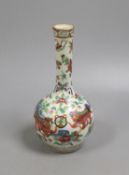 A 19th century Chinese famille rose bottle vase (dogs of fo)17 cms high.