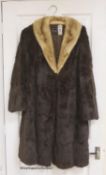 A ladies dark brown squirrel coat with blond mink collar by Baray Furs.