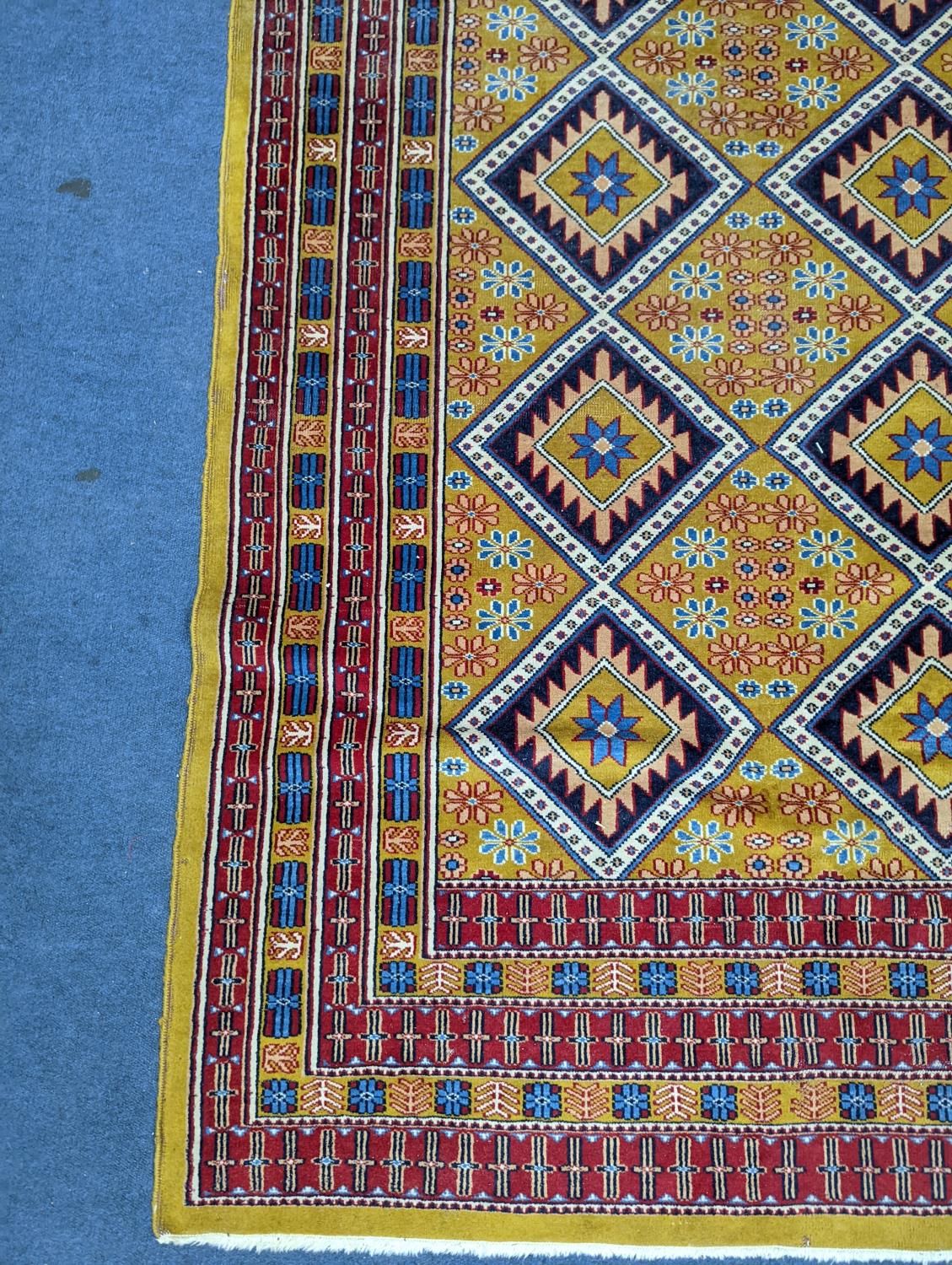 A Caucasian style gold ground rug, 190 x 124cm - Image 2 of 5