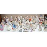 A large collection of small to medium German, French and English porcelain figurines and groups,