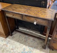 A reproduction oak side table, fitted two drawers, width 106cm, depth 43cm, height 80cm