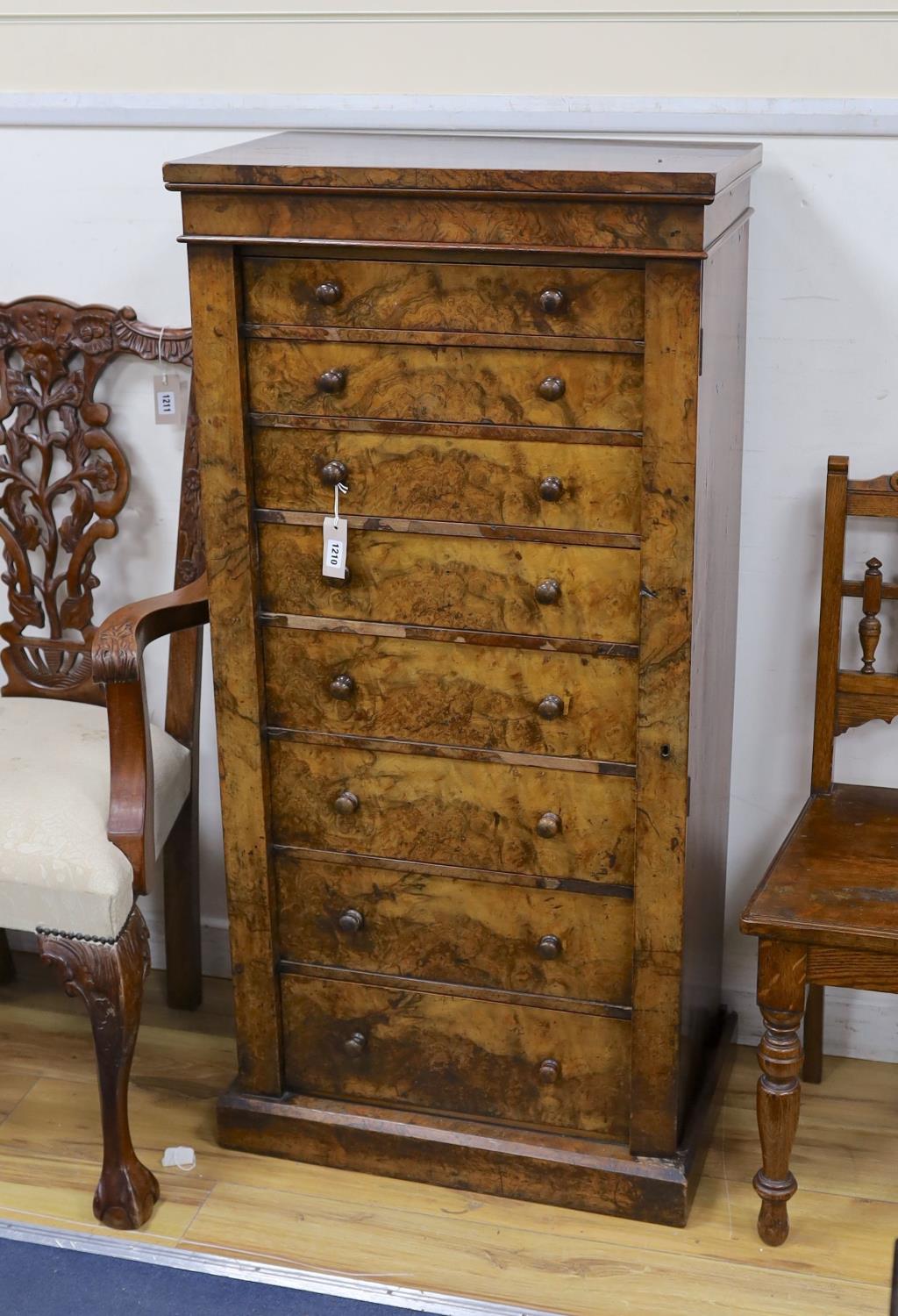 A Victorian figured walnut eight drawer Wellington chest with single locking bar, width 61cm,