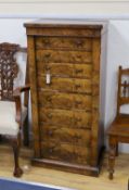 A Victorian figured walnut eight drawer Wellington chest with single locking bar, width 61cm,