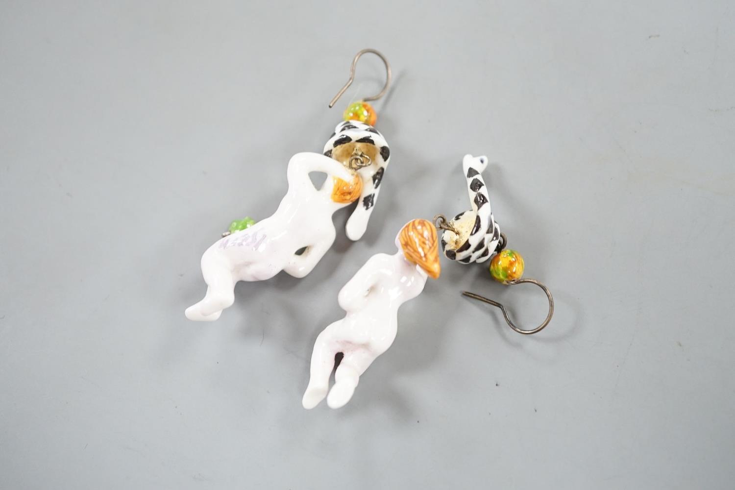 A pair of painted porcelain 'Adam & Eve with serpent' drop earrings, 62mm - Image 3 of 5