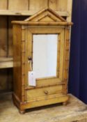 A 19th century French miniature birds eye maple and pine armoire, width 27cm, depth 14cm, height