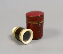 A 19th century ivory and tortoiseshell monocular in red leather case.Monocular 4.5 cms high, case