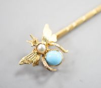 An Edwardian yellow metal, turquoise and seed pearl set bug stick pin, 65mm, gross weight 1.4