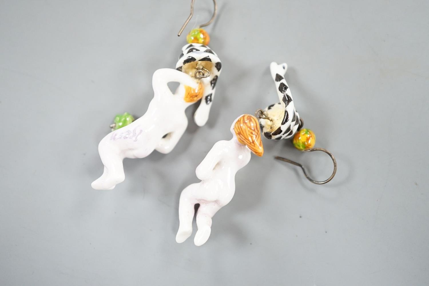A pair of painted porcelain 'Adam & Eve with serpent' drop earrings, 62mm - Image 4 of 5