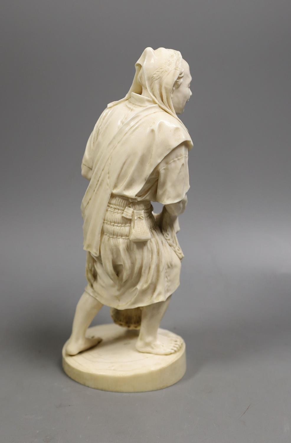 A large Japanese Tokyo School ivory figure of a fisherman, signed, Meiji period,26 cms high. - Image 4 of 5