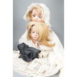 A German Porzellanfabrik Burggrab bisque headed doll, one other bisque headed doll