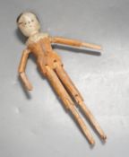 A 19th German carved wood peg doll 32cm