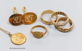 A pair of 9ct gold oval cufflinks with engraved initials, three various 9ct gold rings including