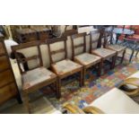 A set of six Regency provincial mahogany dining chairs with drop in rush seats