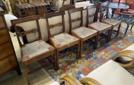 A set of six Regency provincial mahogany dining chairs with drop in rush seats