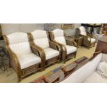 A caned bamboo six piece conservatory suite comprising four armchairs with loose cushions, width