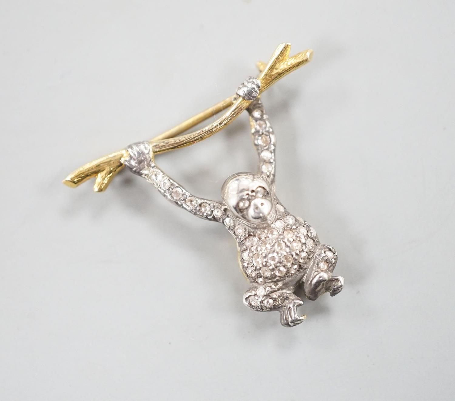 A Victorian style novelty white and yellow metal, diamond chip set brooch, modelled as a monkey