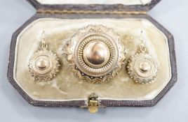 A Victorian yellow metal suite of jewellery, comprising a brooch and pair of earrings, brooch