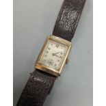 A gentleman's 1930's 9ct gold rectangular dial manual wind gold wrist watch.