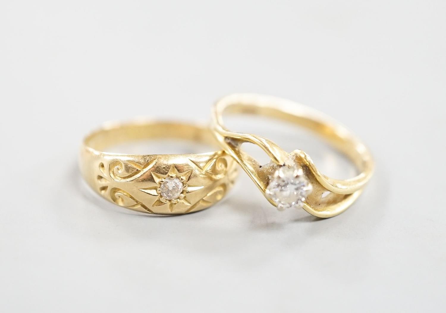 A George V 18ct gold and diamond chip set ring, size O and a later 750 yellow metal and solitaire