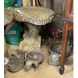 A reconstituted stone garden bird bath, width 44cm, height 43cm together with four small