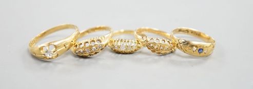 Three early 20th century 18ct gold and five stone diamond chip set rings, an 18ct , sapphire and