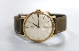 A gentlemen's late 1950's 9ct gold Omega manual wind wristwatch, on Omega leather strap with 9ct