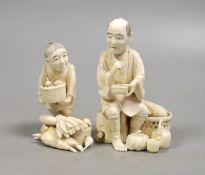 A Japanese ivory group of a farmer and boy, early 20th century,farmer 11.5 cms high.